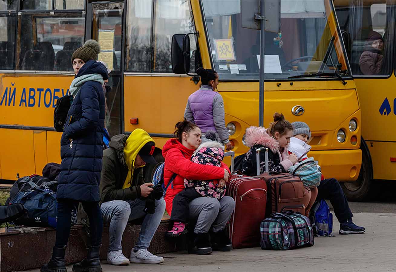 Ukrainian waiting outside bus stop